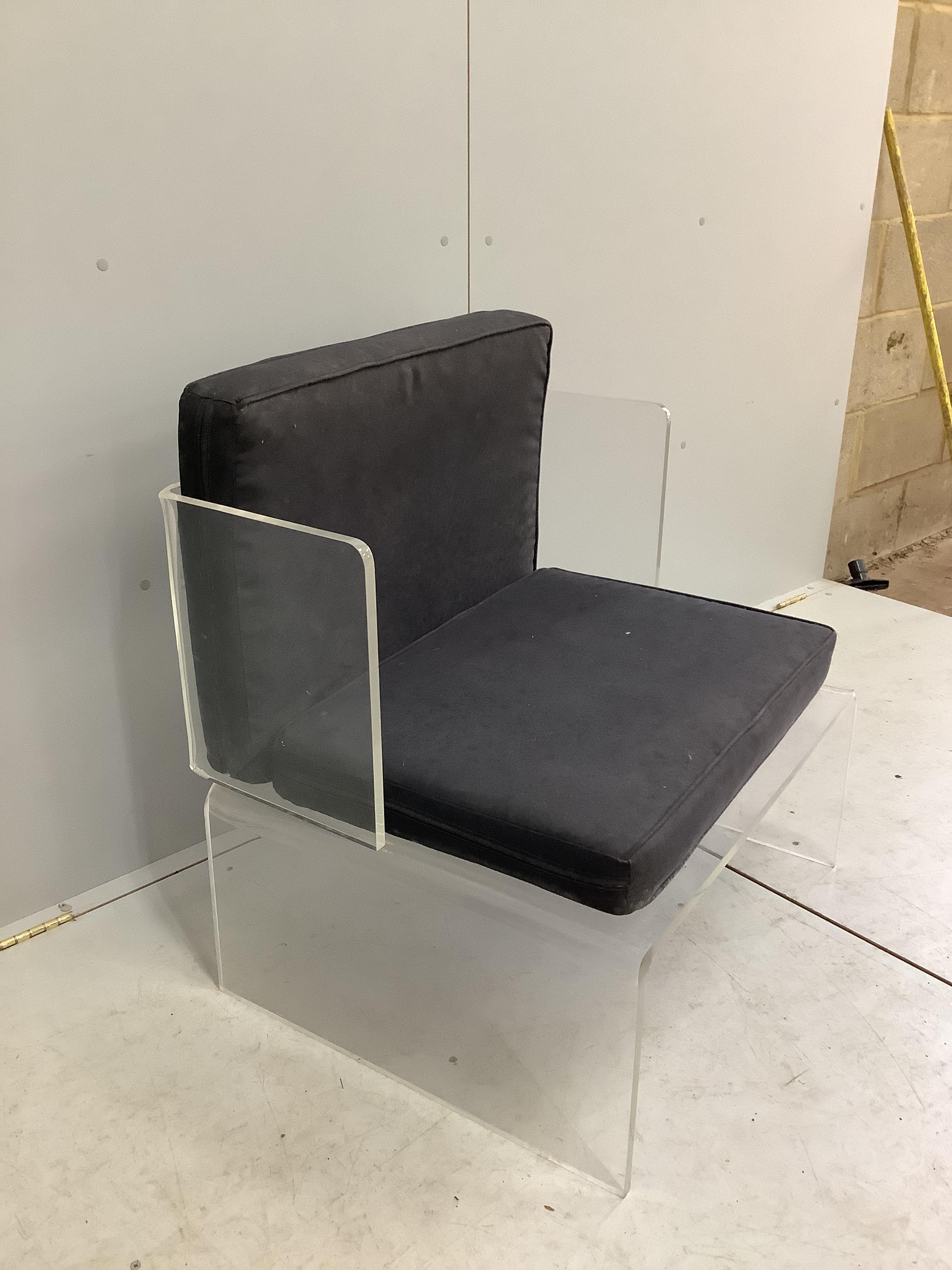 A contemporary mid century Lucite acrylic chair, width 73cm, depth 60cm, height 80cm